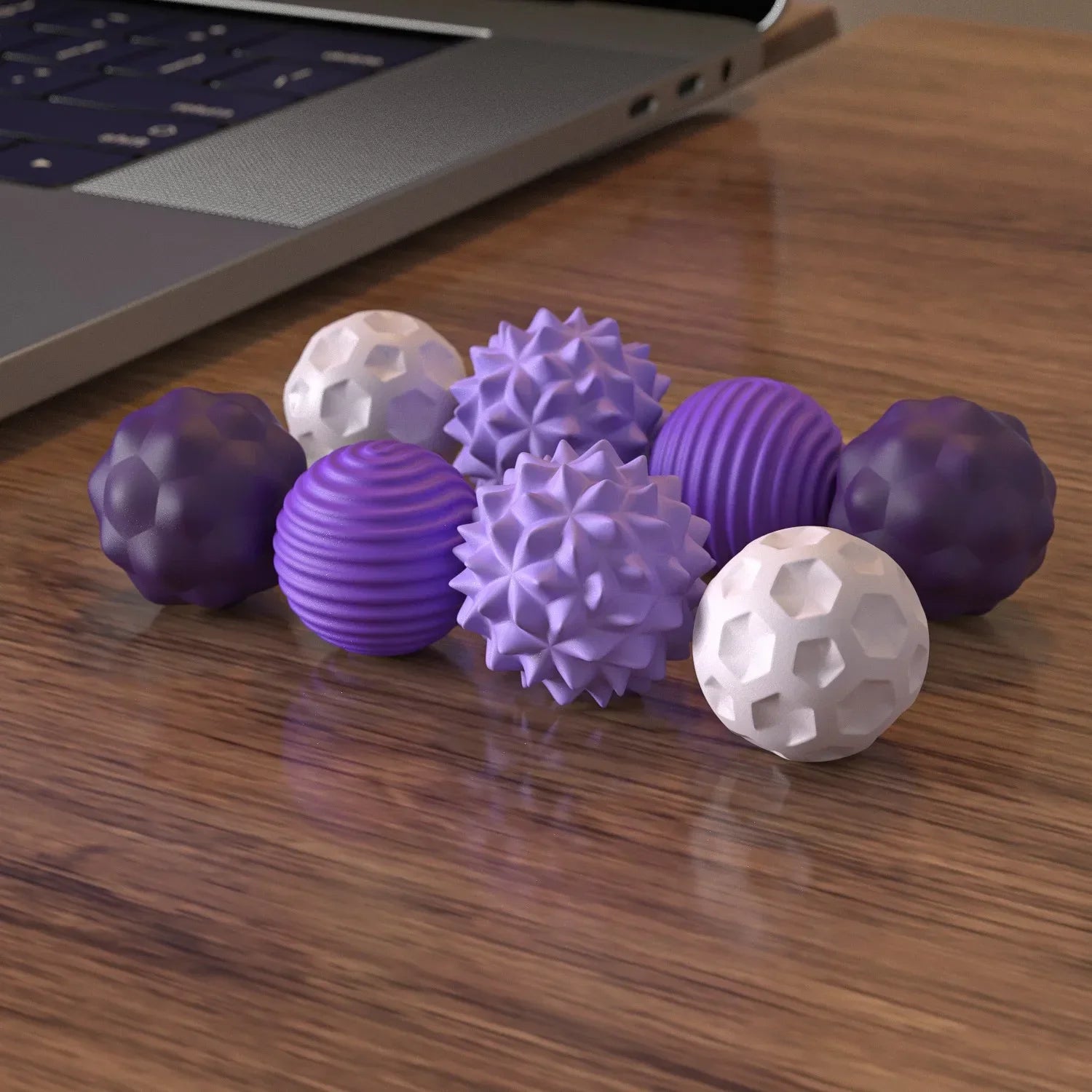Person squeezing Kinect stress ball at office desk